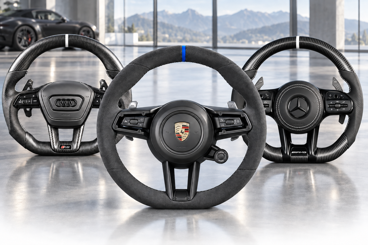 Audi, Porsche and Mercedes custom steering wheels in a premium showroom