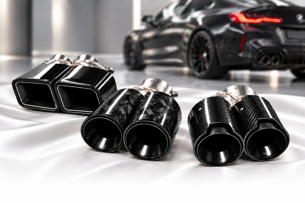 Black rectangular, forged carbon and woven carbon exhaust tips in a premium showroom